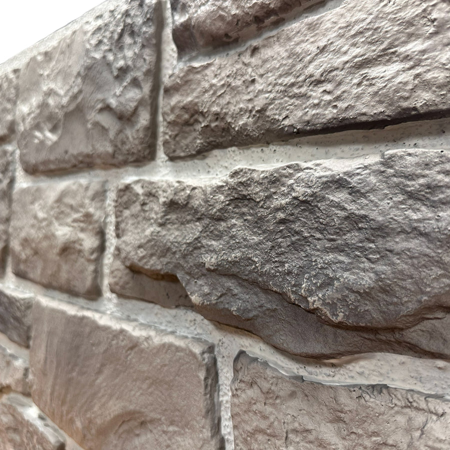 Close-up of Cotswold Stone in Abbey Grey showing the aged grey and taupe stone tones