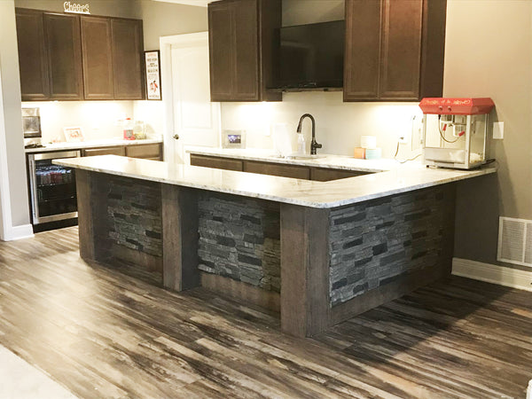 Lightning Ridge faux stone panel in Grey Fox – accent wall installed by a DIY homeowner