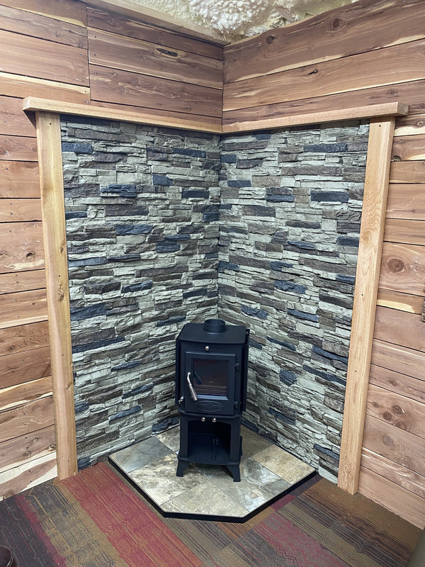 Lightning Ridge faux stone panel in Nature's Spirit – log burner wall installed by a DIY homeowner